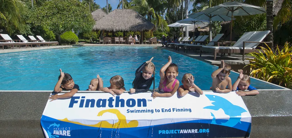 Kids supporting Project Aware in the Atmosphere Resort Pool in the Philippines