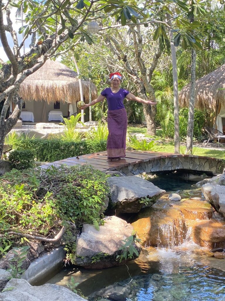 Atmosphere Resorts & Spa staff member welcoming guests at the Sanctuary Spa.
