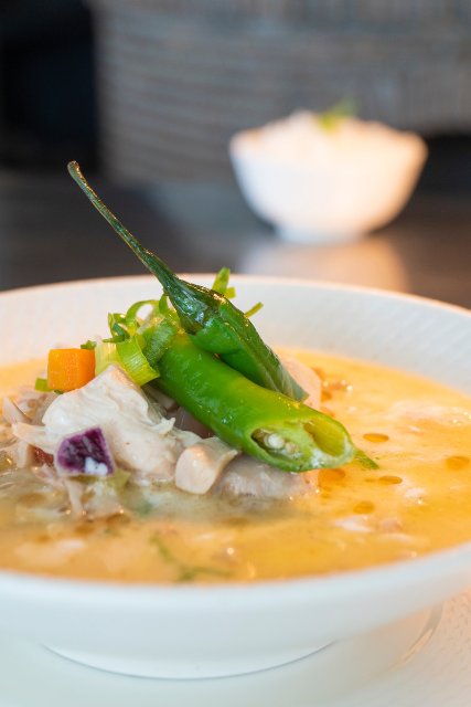 A bowl of Halang-Halang, a Filipino spicy chicken soup made with coconut milk, vegetables, and green chili peppers, served at Atmosphere Resorts & Spa.