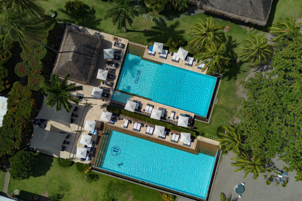 Aerial view of the swimming pools at Atmosphere Resorts & Spa in Dauin, Negros Oriental, Philippines.
