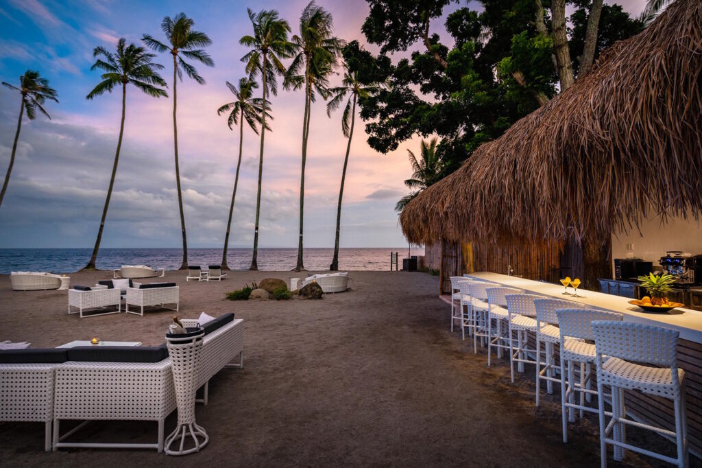 Beach Bar at Atmosphere Resorts & Spa at sunset in Dauin, Negros Oriental, Philippines.