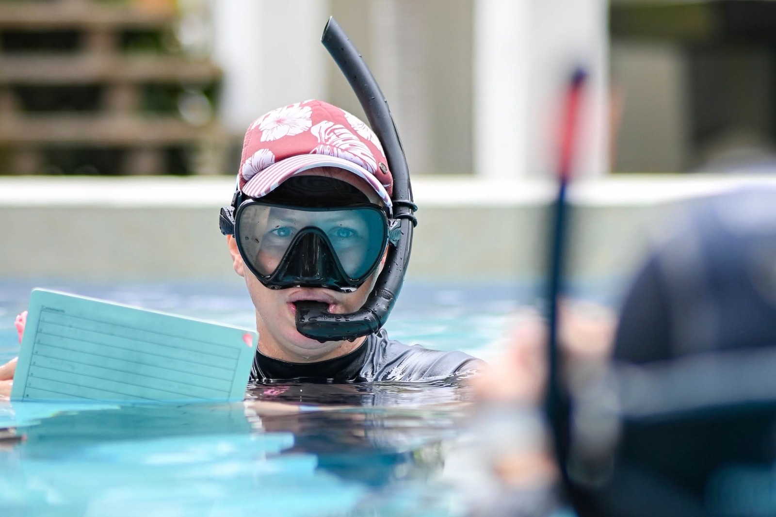 PADI Course Director Berlinda wearing a snorkel and mask during pool training at Atmosphere Resorts & Spa