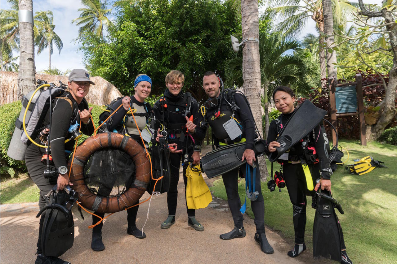 PADI Instructor Development Course students in scuba diving equipment at Atmosphere Resorts & Spa